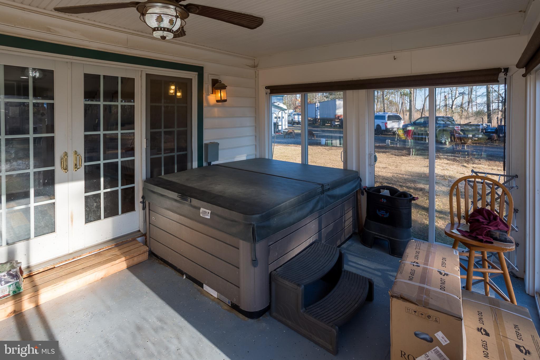 3819 Maple Dam Road Cambridge, MD 21613 - Photo 21 of 79 a living room with furniture and a floor to ceiling window