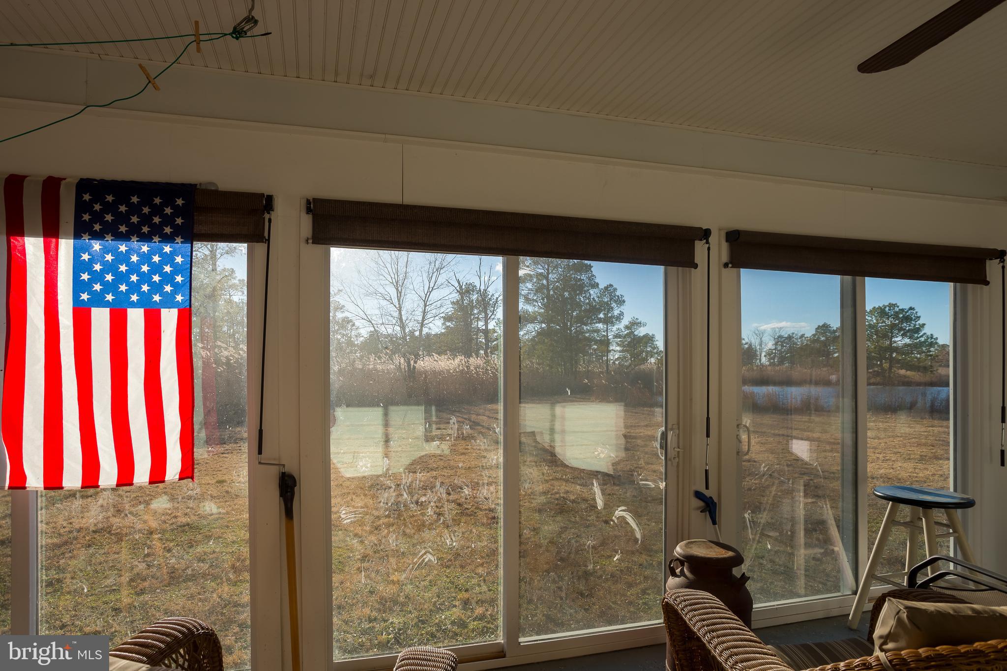 3819 Maple Dam Road Cambridge, MD 21613 - Photo 23 of 79 a bathroom with a glass door