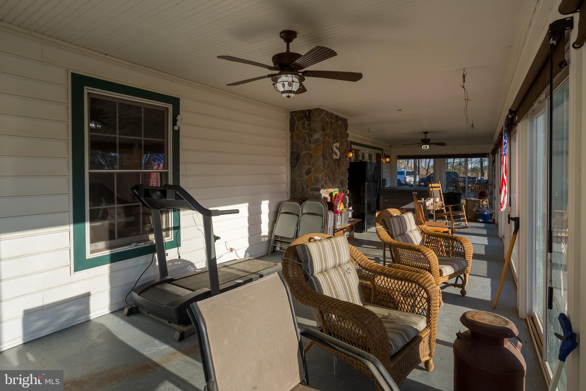 3819 Maple Dam Road Cambridge, MD 21613 - Photo 24 of 79 a view of a livingroom with furniture and a window