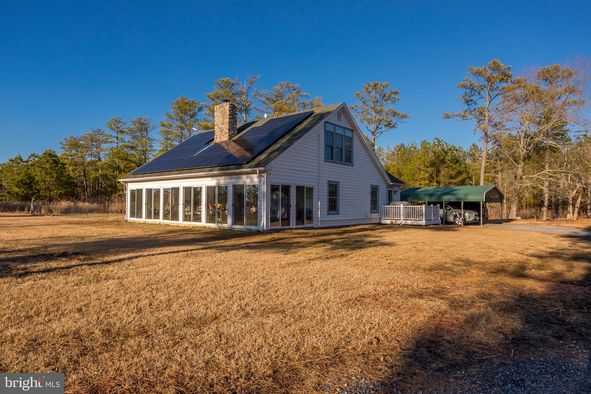 3819 Maple Dam Road Cambridge, MD 21613 - Photo 3 of 79 a front view of a house with a yard