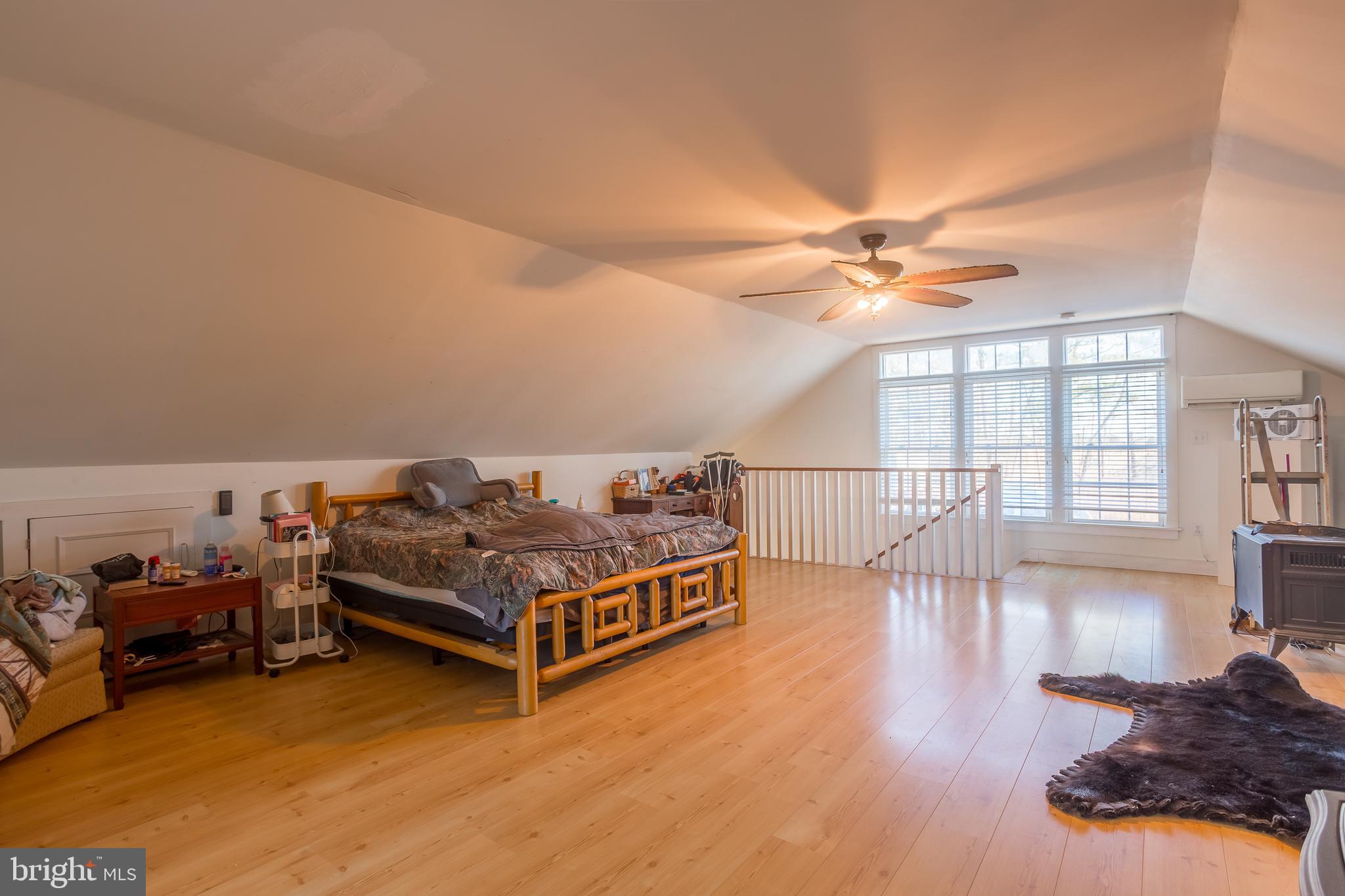 3819 Maple Dam Road Cambridge, MD 21613 - Photo 31 of 79 a living room with furniture a flat screen tv and a large window