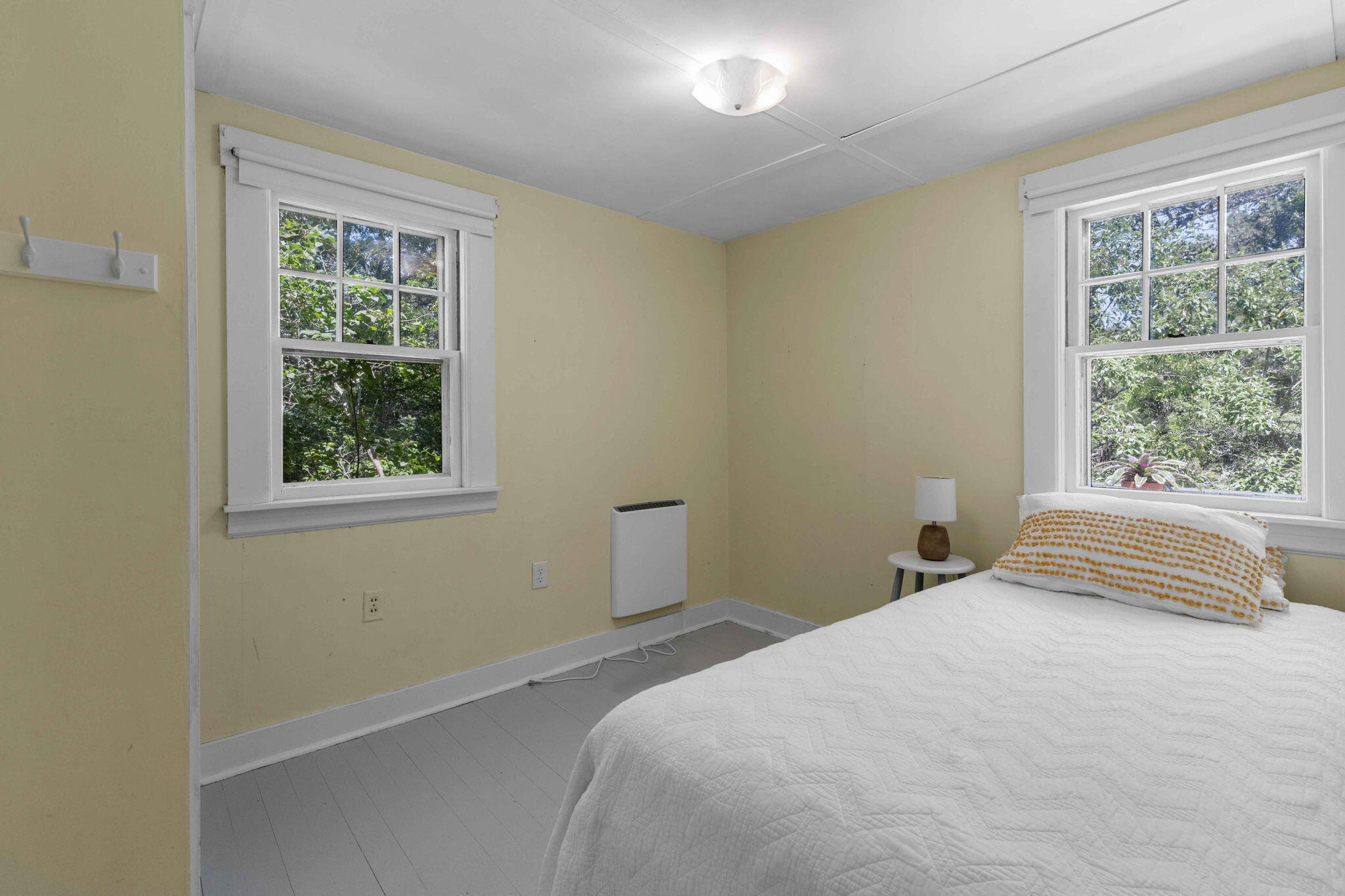 11 Whitmanville Road Truro, MA 02666 - Photo 16 of 31 a bedroom with a bed and a window