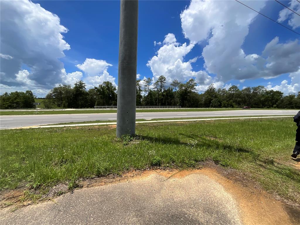 101 Hickory Lane Interlachen, FL 32148 - Photo 2 of 10 a view of a big yard next to a lake