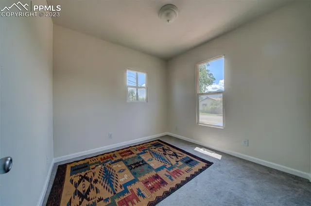 a view of an empty room and window
