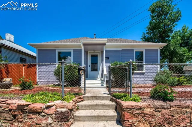 a front view of house with yard