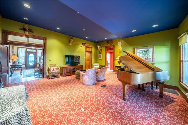 a bedroom with table tennis air hockey table and windows