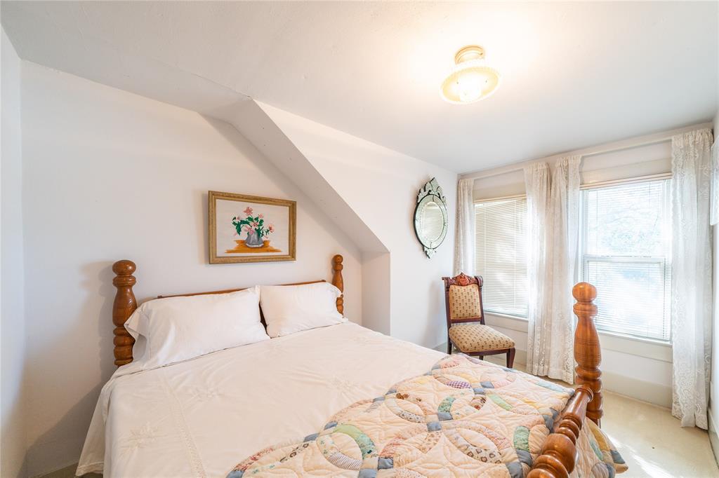 318 Northwest Ave A Hamlin, TX 79520 - Photo 18 of 23 a bedroom with a bed and a window