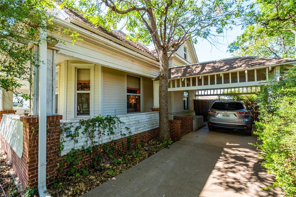 318 Northwest Ave A Hamlin, TX 79520 - Photo 20 of 23 a front view of a house with a garden