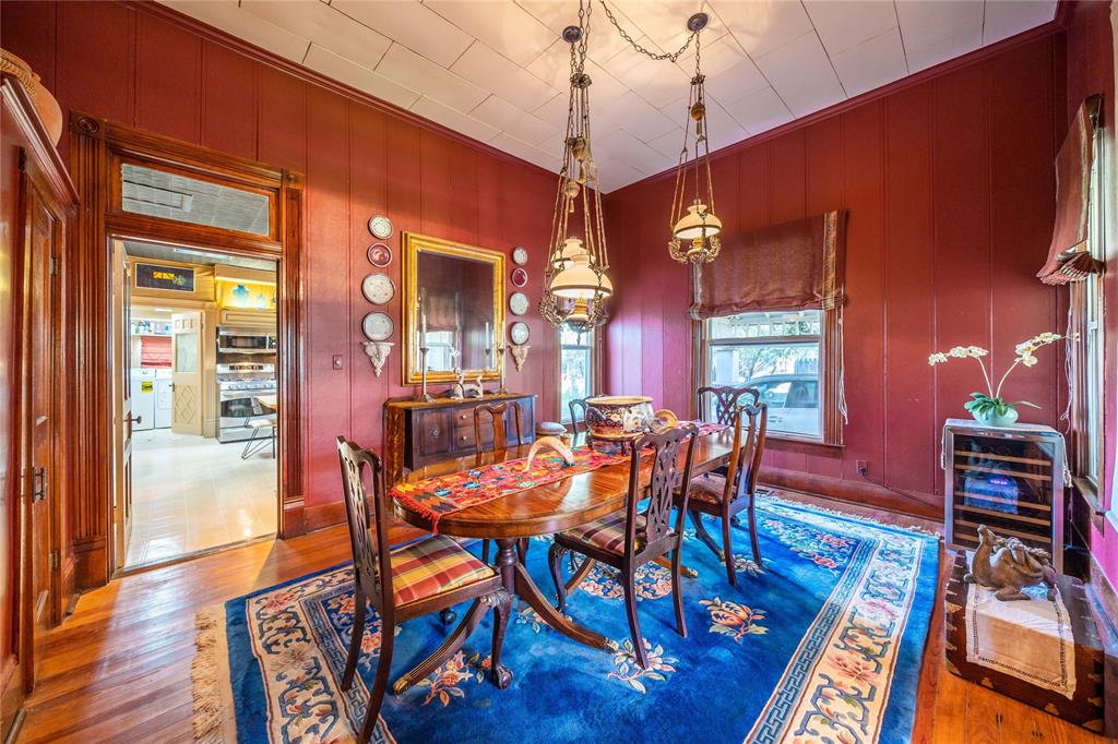 318 Northwest Ave A Hamlin, TX 79520 - Photo 8 of 23 a view of a dining room with furniture and wooden floor