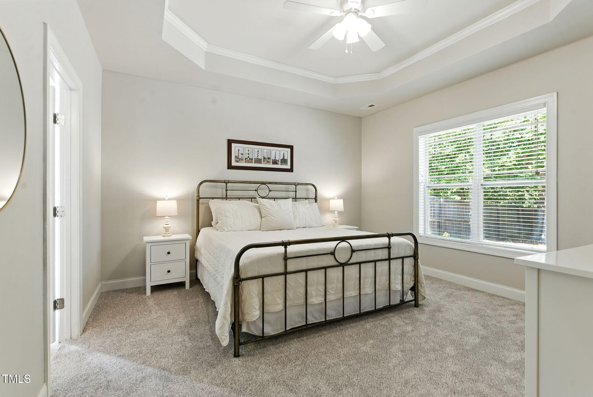 311 Coachmans Trail Stem, NC 27581 - Photo 12 of 27 a bedroom with a bed and a window