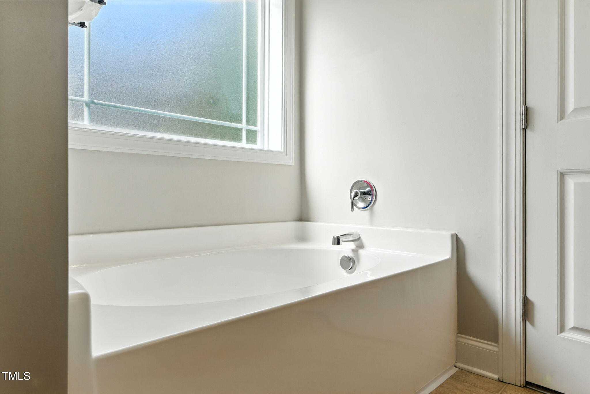 311 Coachmans Trail Stem, NC 27581 - Photo 16 of 27 a bathroom with a tub
