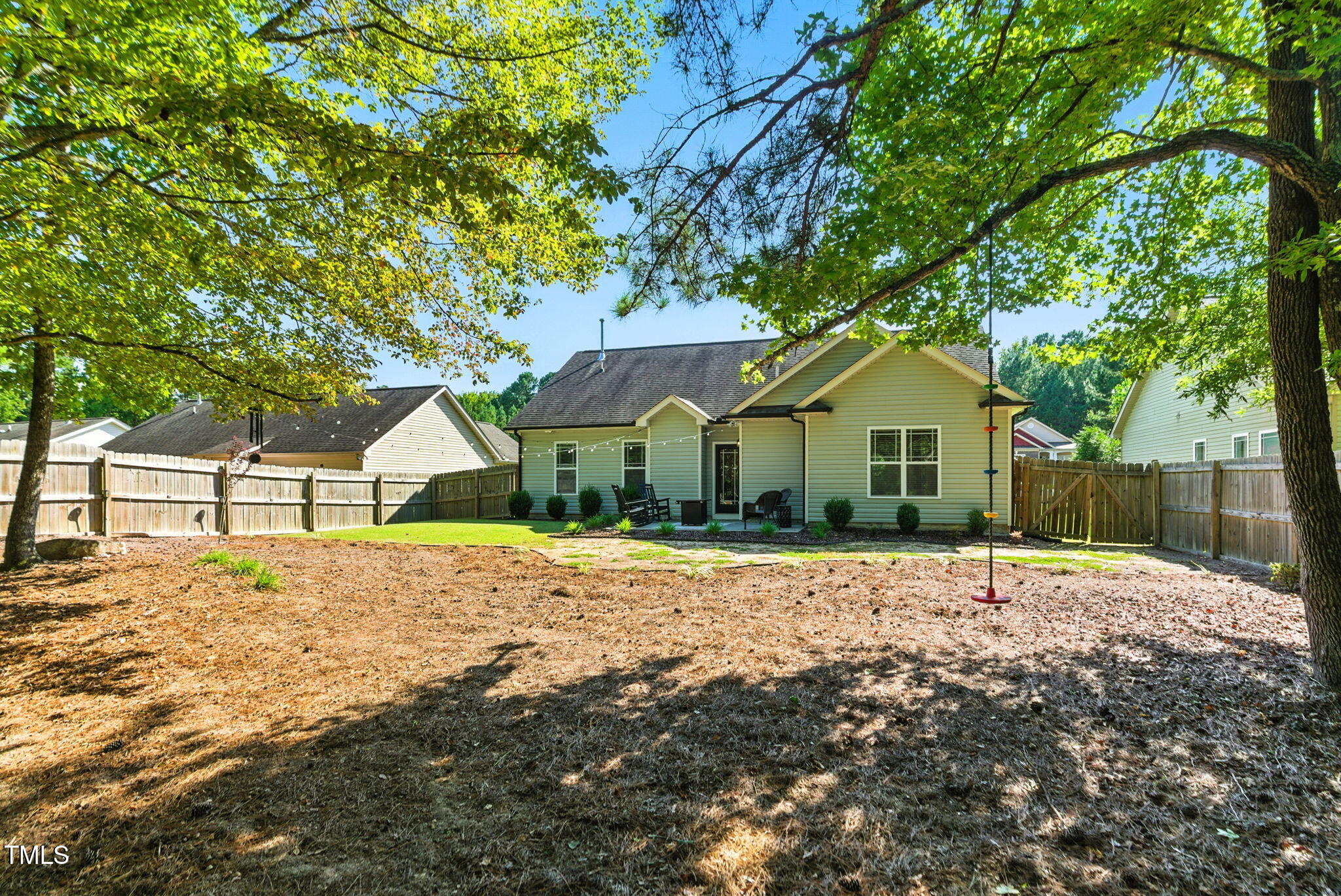 311 Coachmans Trail Stem, NC 27581 - Photo 21 of 27 a front view of a house with a yard and garage