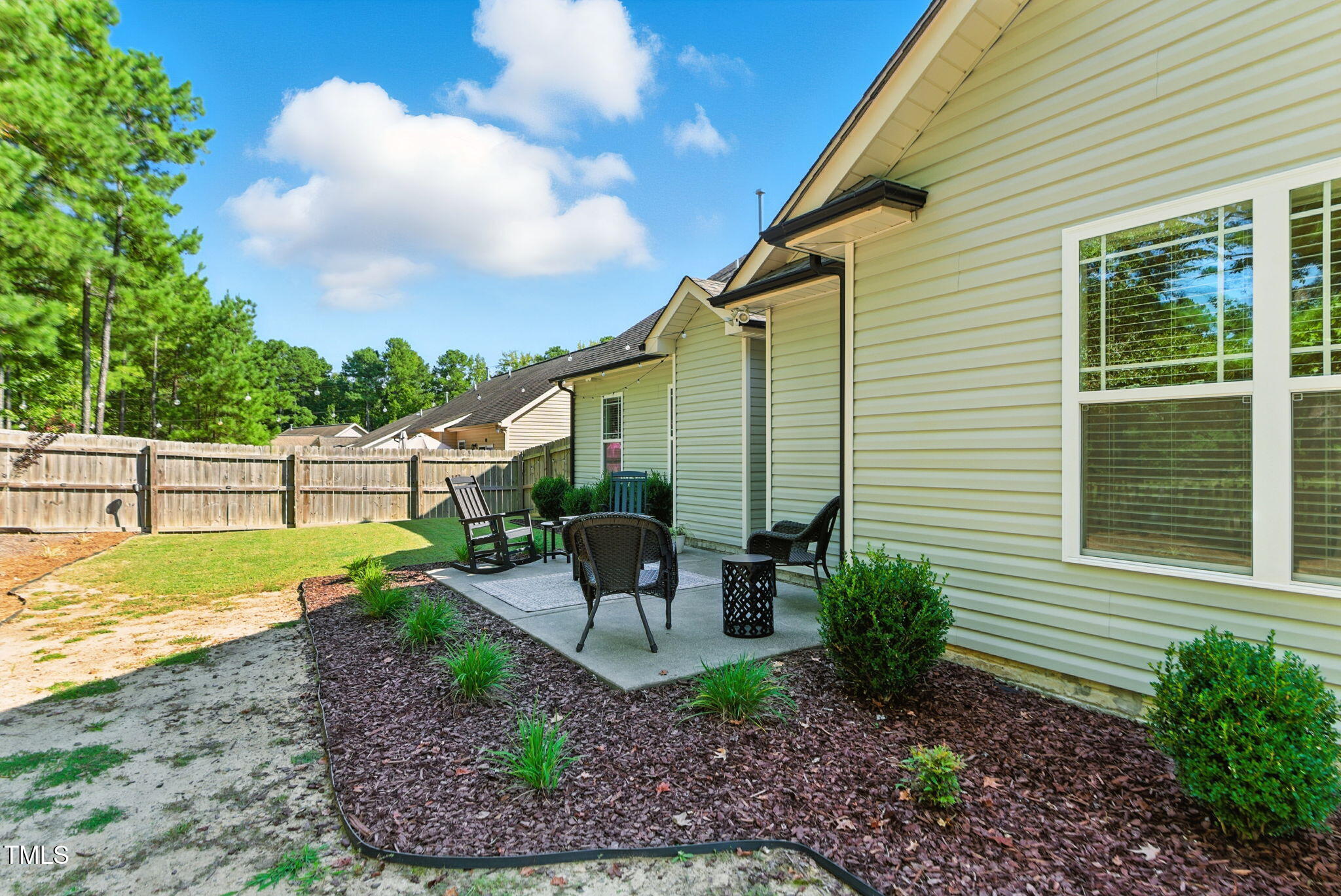 311 Coachmans Trail Stem, NC 27581 - Photo 23 of 27 a view of a house with backyard and sitting area