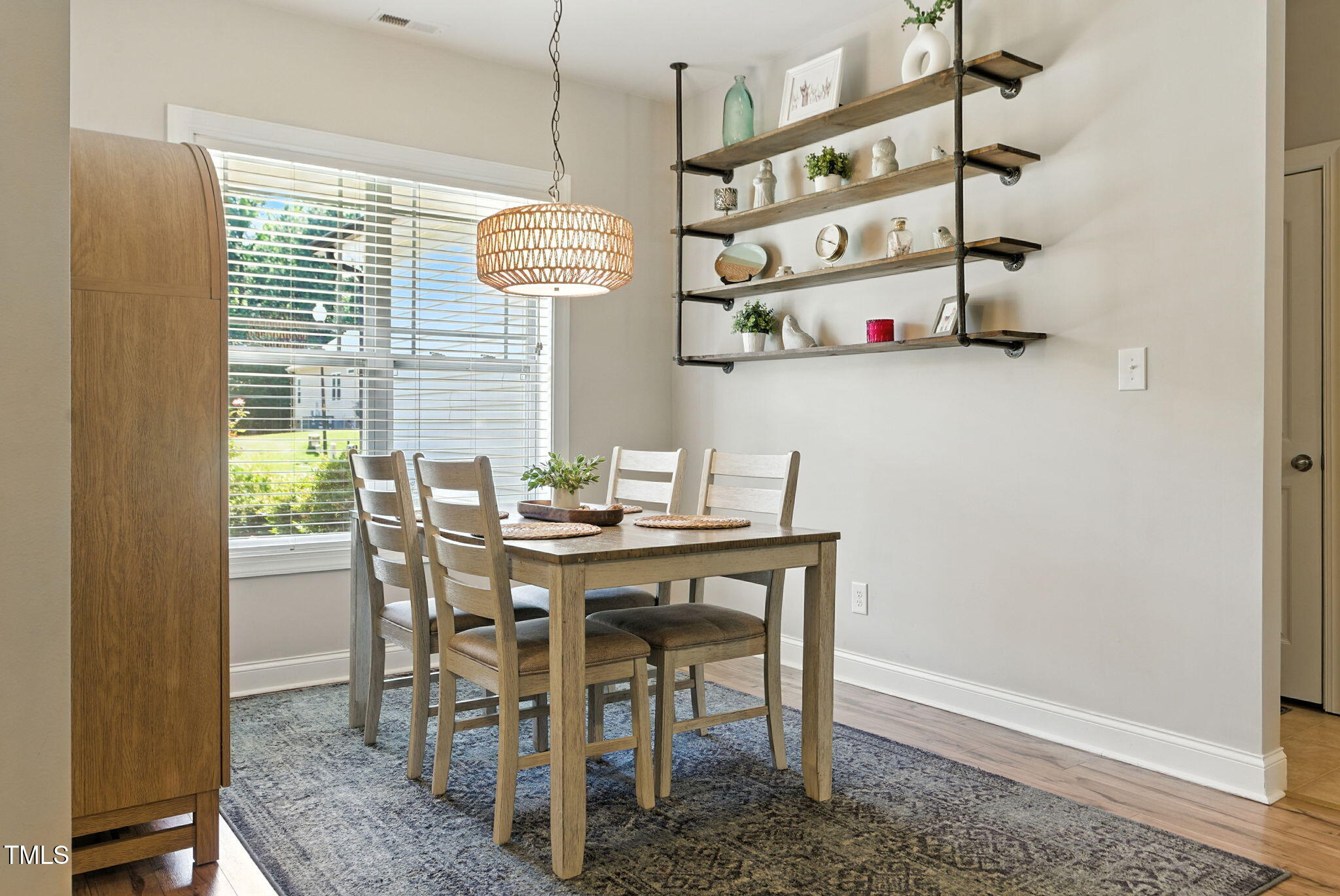 311 Coachmans Trail Stem, NC 27581 - Photo 4 of 27 a view of a dining room with furniture and chandelier