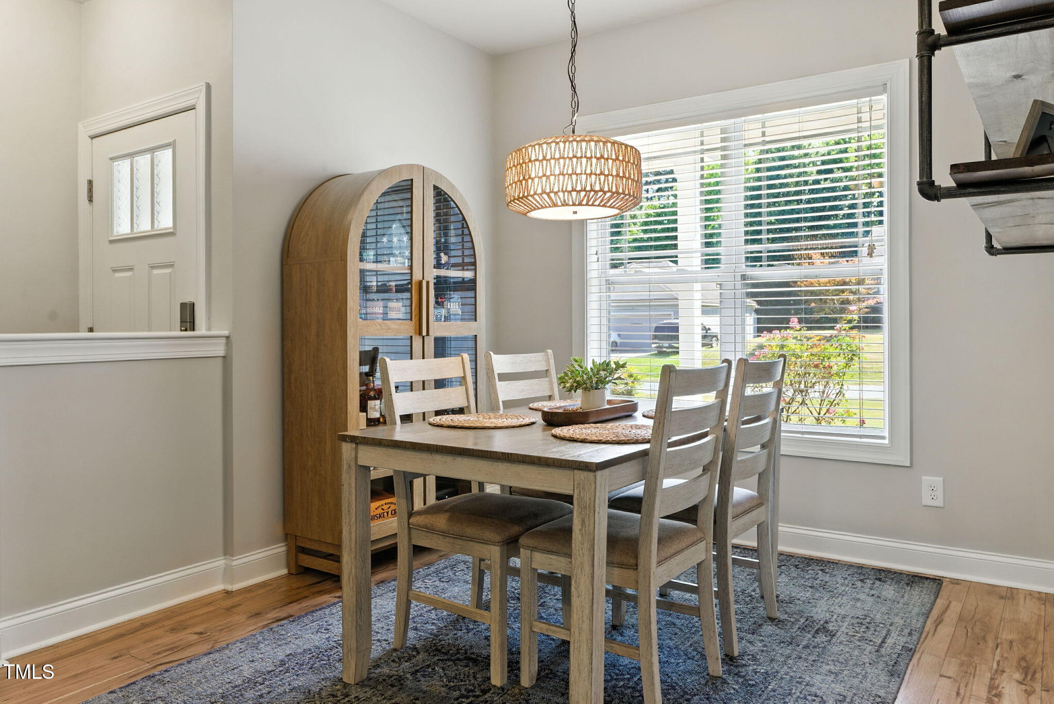 311 Coachmans Trail Stem, NC 27581 - Photo 5 of 27 a view of a dining room with furniture window and wooden floor