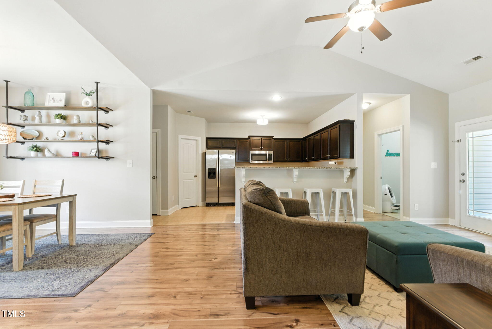 311 Coachmans Trail Stem, NC 27581 - Photo 7 of 27 a living room with furniture and a wooden floor