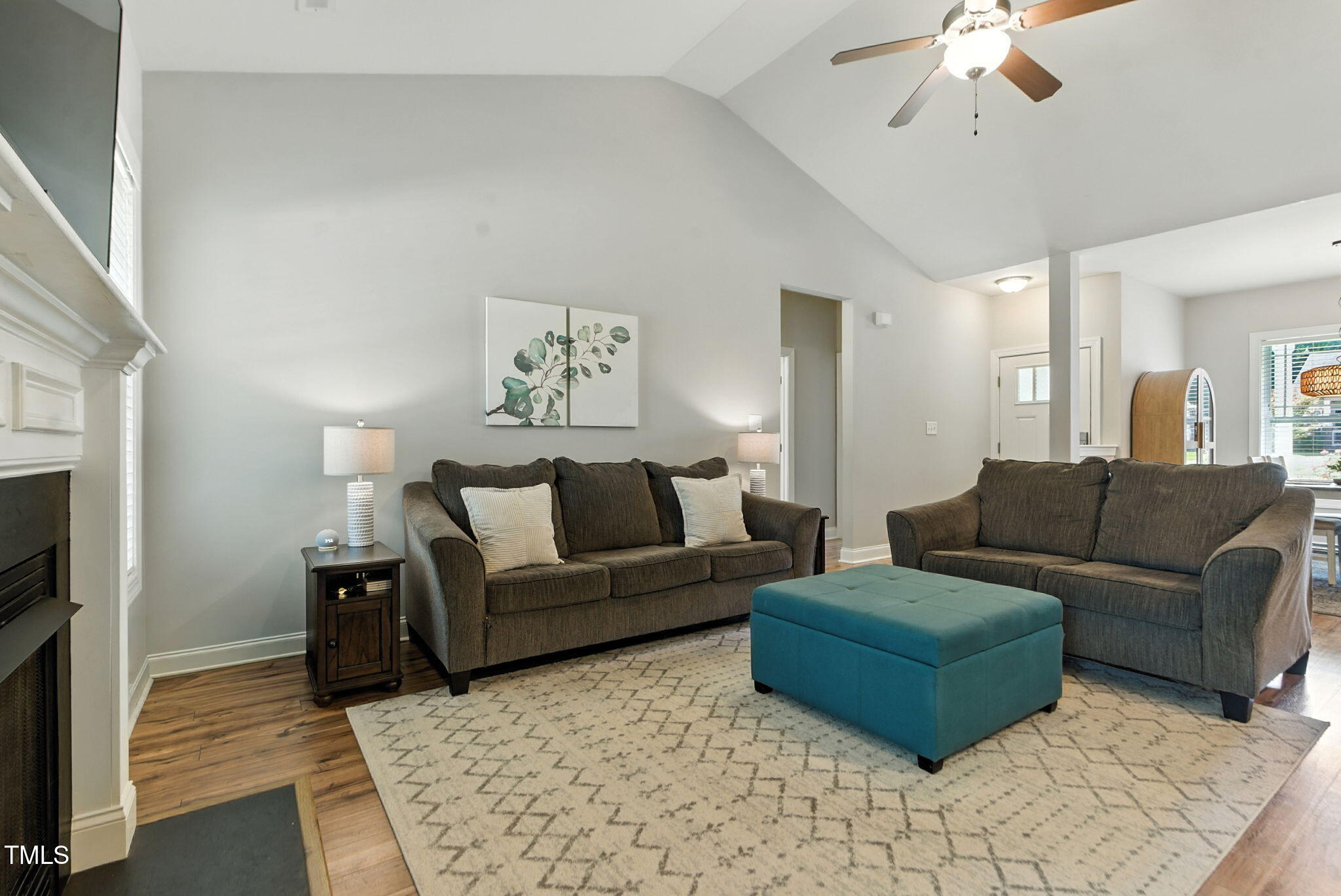 311 Coachmans Trail Stem, NC 27581 - Photo 8 of 27 a living room with furniture and a fireplace