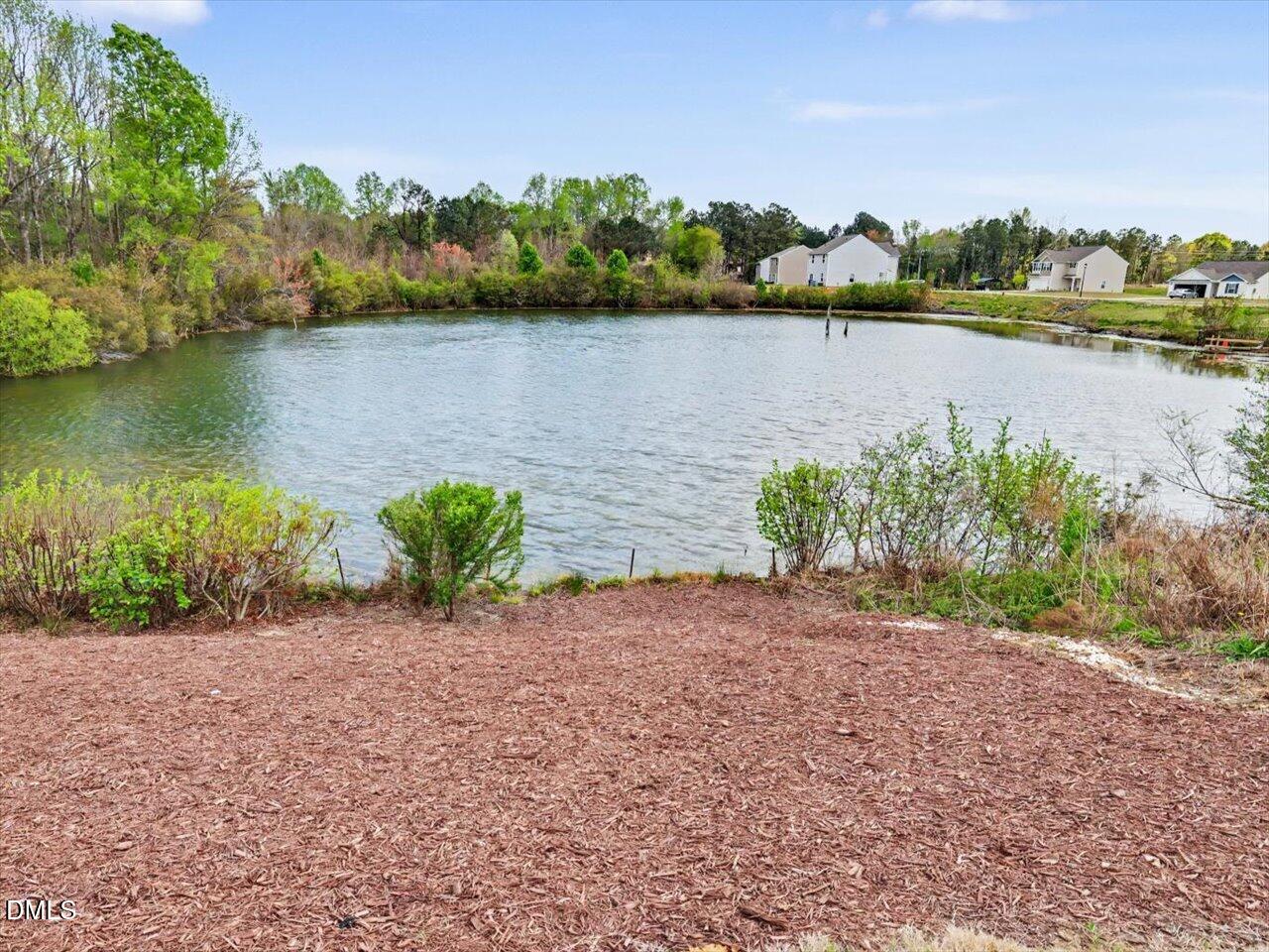 90 Barnsley Road Angier, NC 27501 - Photo 35 of 40 an aerial view of a houses with a lake view