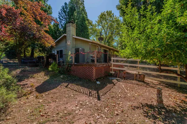 a view of a small house in the back yard