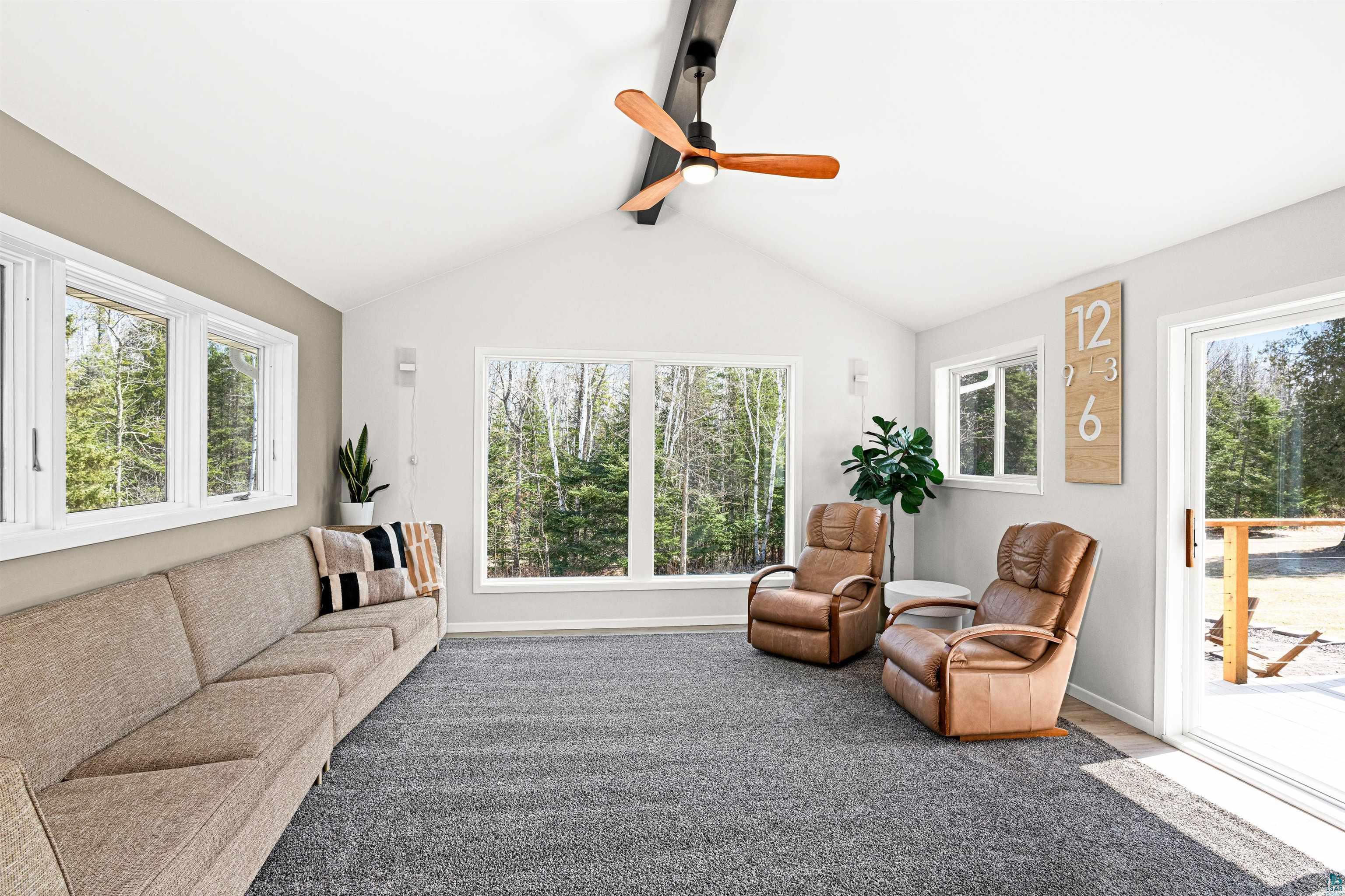 5638 Bergquist Road Duluth, MN 55804 - Photo 19 of 43 Sunken living area featuring vaulted ceiling & ceiling fan