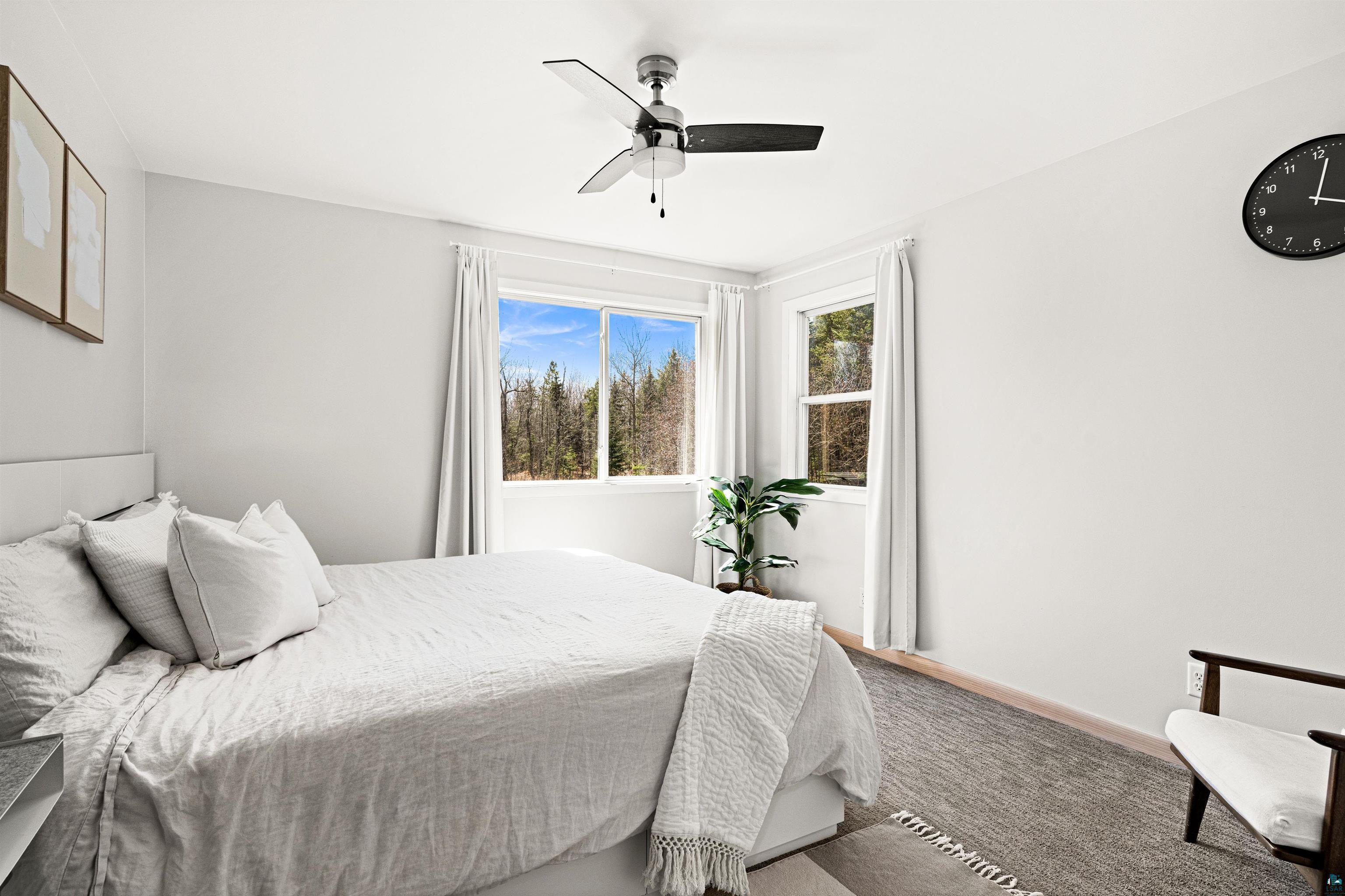 5638 Bergquist Road Duluth, MN 55804 - Photo 25 of 43 Carpeted bedroom with ceiling fan & access to walk-in closet & master bath