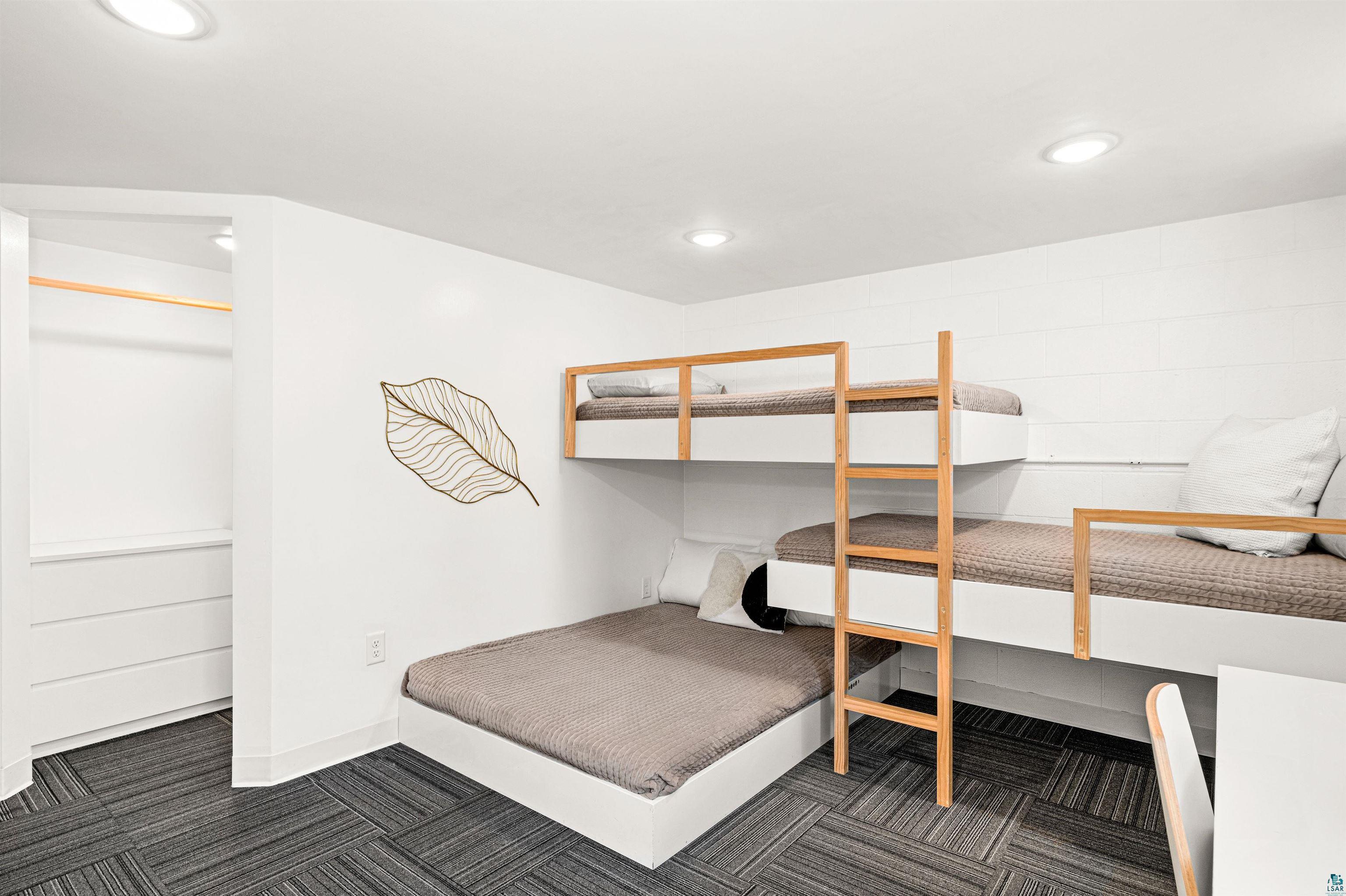 5638 Bergquist Road Duluth, MN 55804 - Photo 33 of 43 3rd Lower Bedroom featuring baseboards, recessed lighting & built-in beds & closet