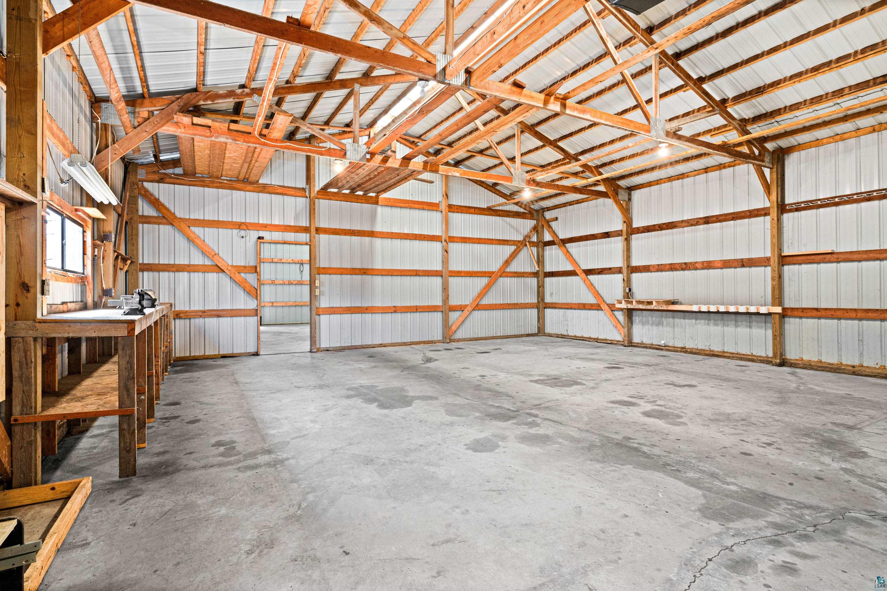 5638 Bergquist Road Duluth, MN 55804 - Photo 38 of 43 Garage/Pole Building featuring concrete floors & overhead doors & electricity
