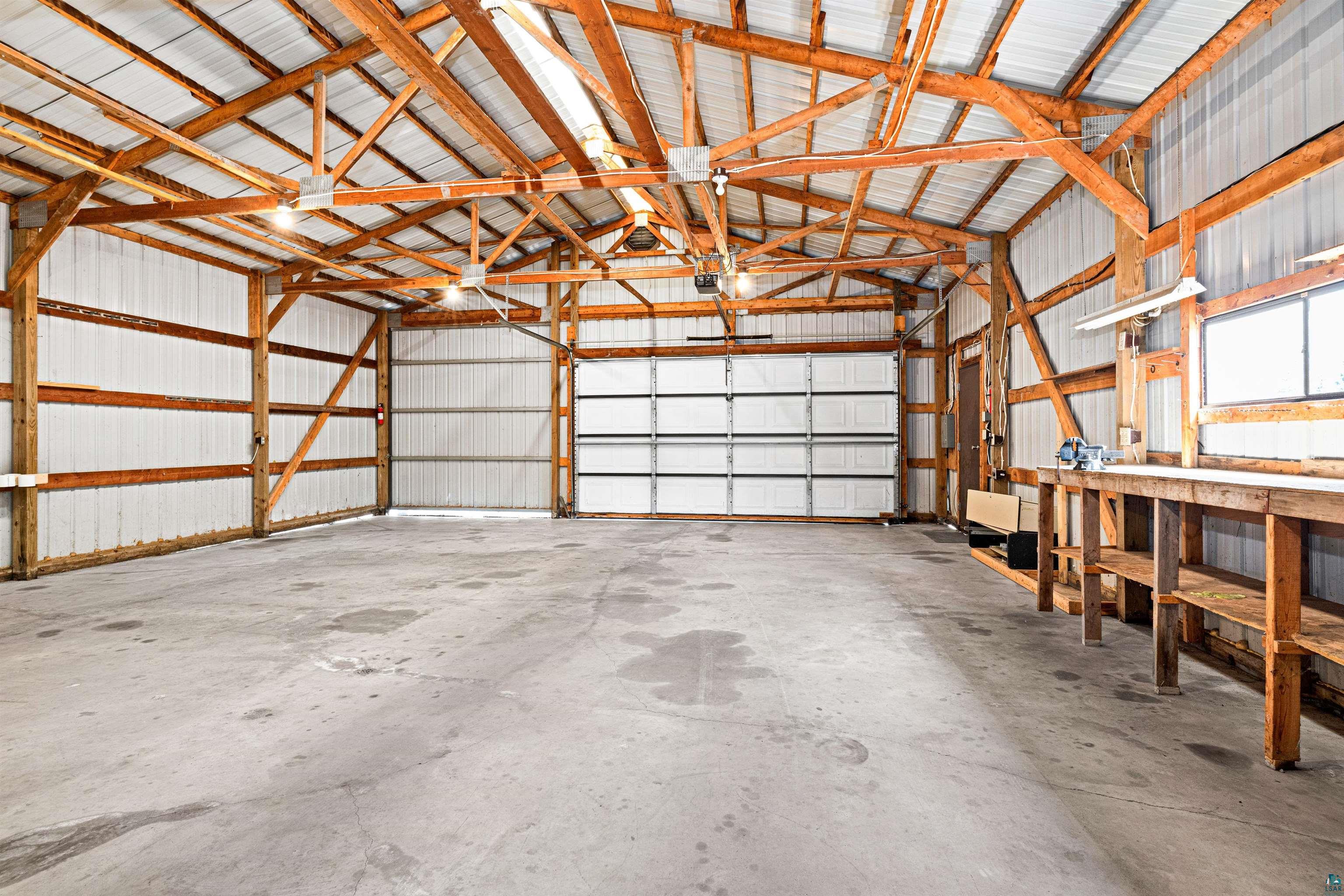 5638 Bergquist Road Duluth, MN 55804 - Photo 39 of 43 Garage with metal walls, overhead doors & sliding door & partitioned into 2 large areas: Approx. 30' x 35' & 30' x 26'.