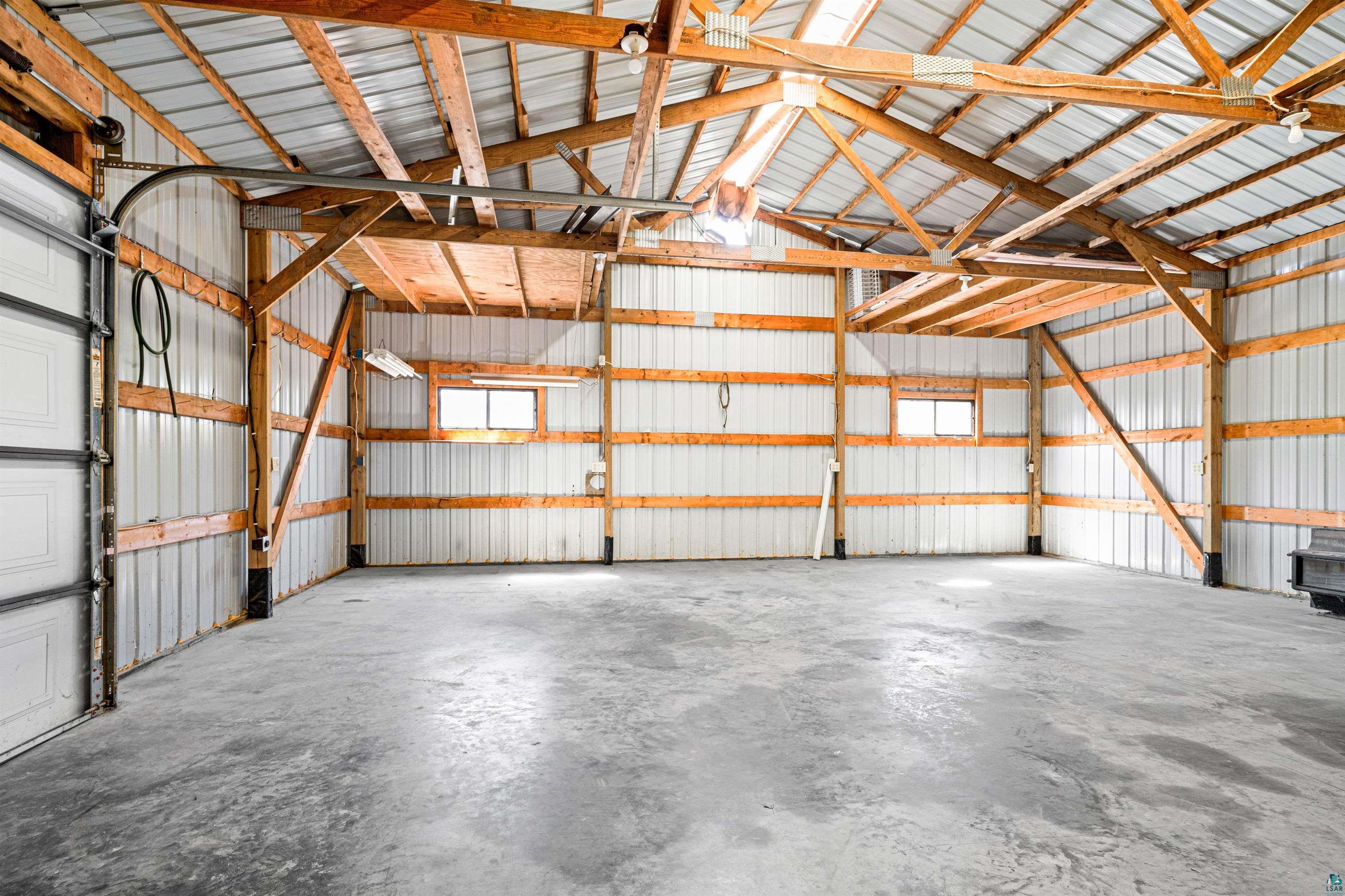 5638 Bergquist Road Duluth, MN 55804 - Photo 40 of 43 Garage with metal walls, concrete & electricity.