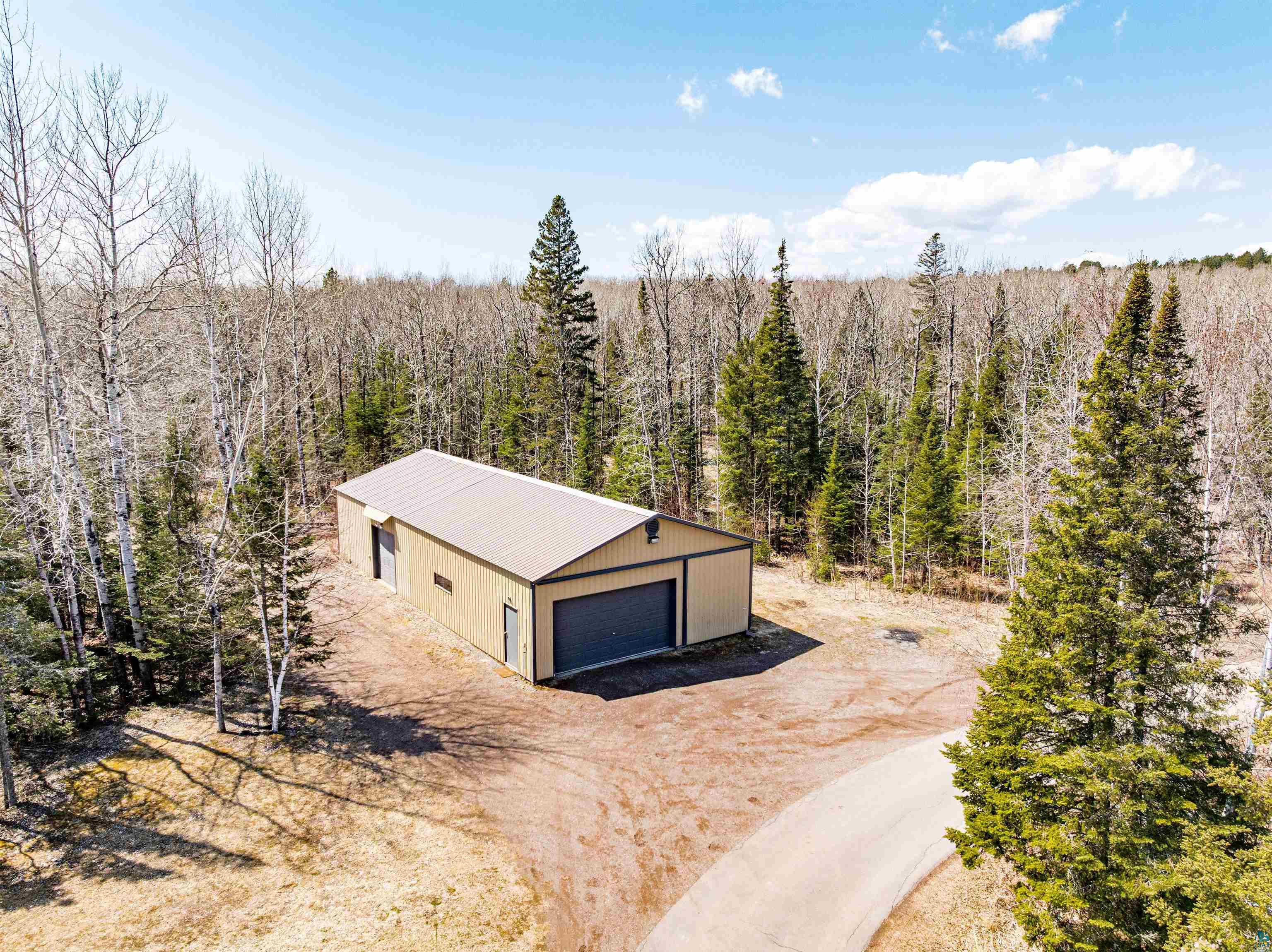 5638 Bergquist Road Duluth, MN 55804 - Photo 4 of 43 Drone / aerial view with a view of trees