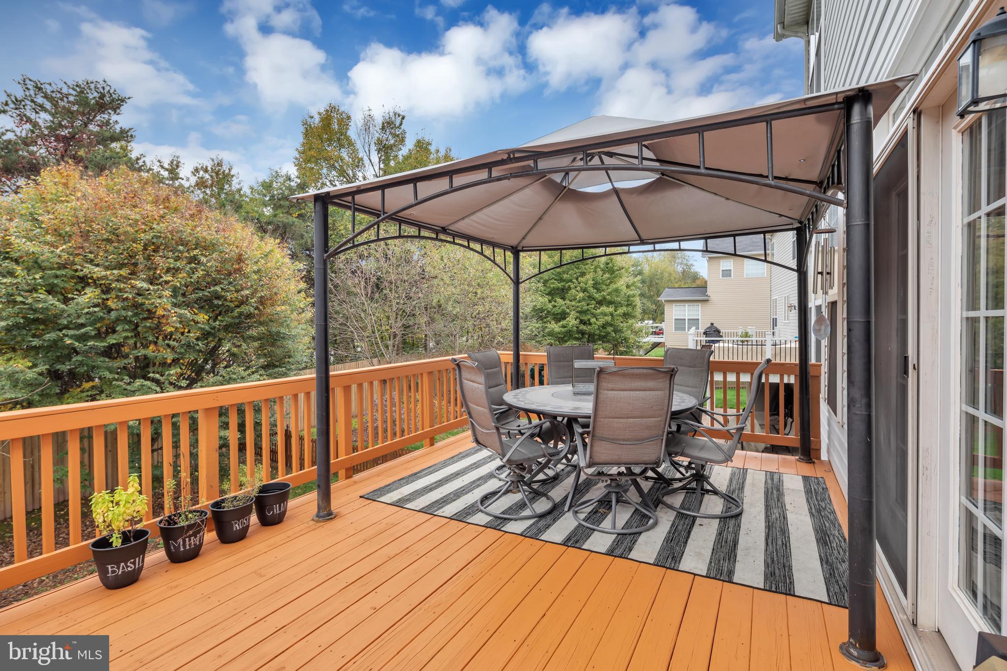 7581 Rio Grande Way Gainesville, VA 20155 - Photo 13 of 52 Back deck off kitchen. Pergola conveys!