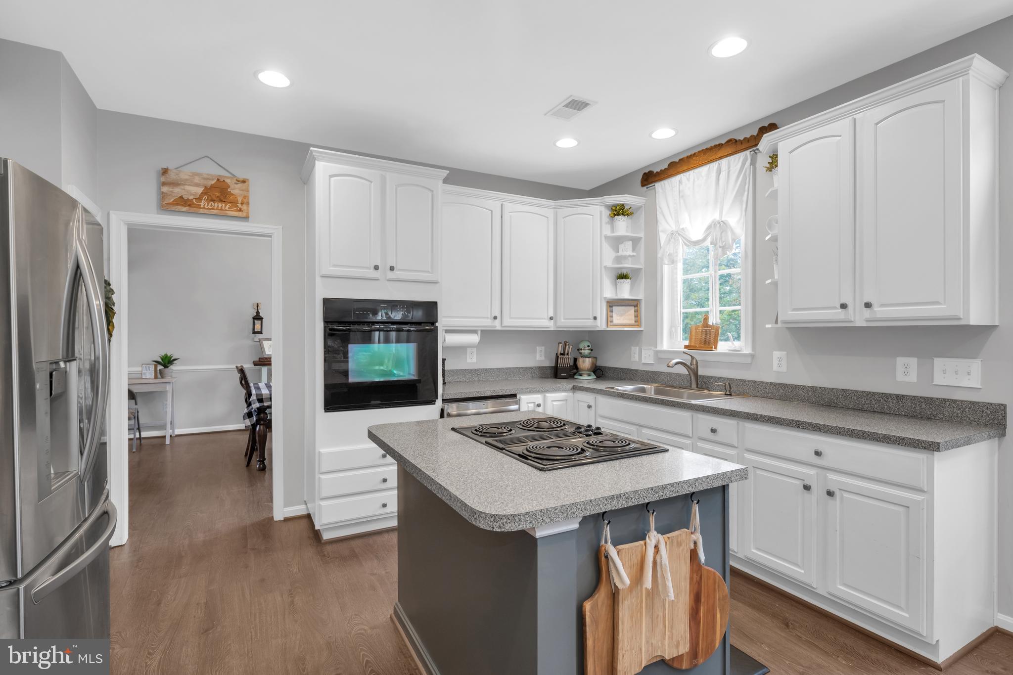 7581 Rio Grande Way Gainesville, VA 20155 - Photo 10 of 52 Painted cabinets and island in kitchen