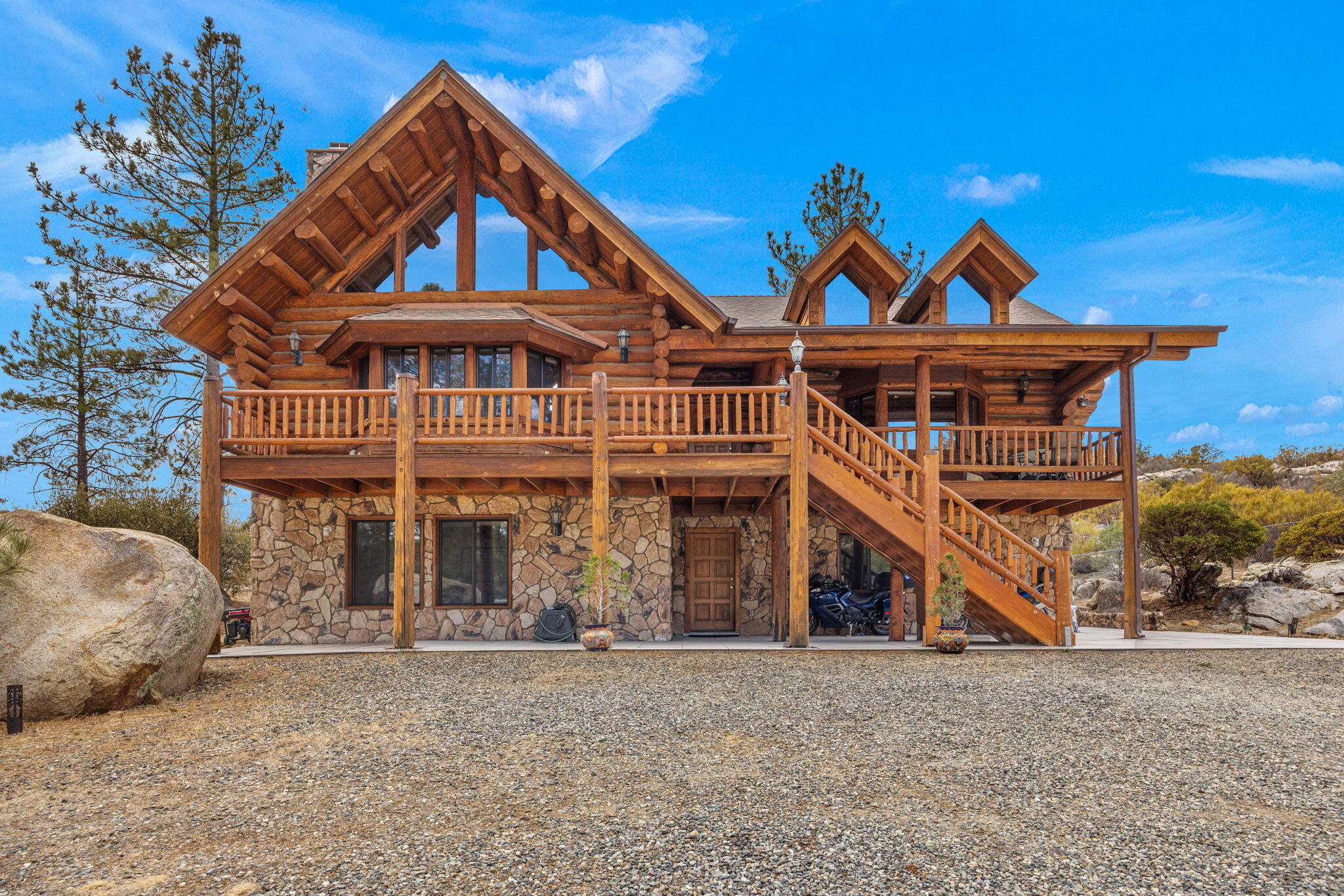 a front view of a house with wooden stairs