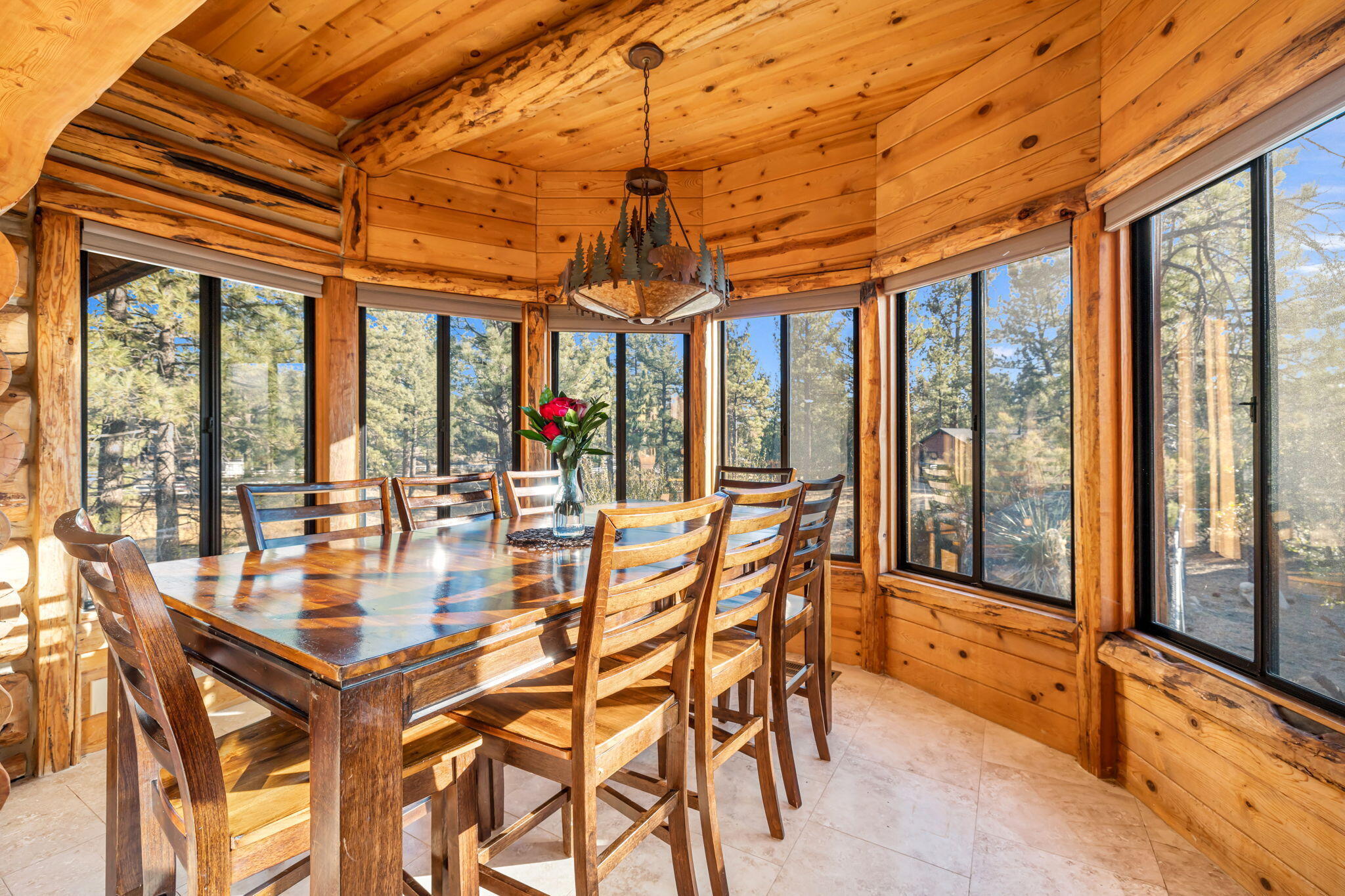 60766 Table Mountain Road Mountain Center, CA 92561 - Photo 13 of 46 a dining room with furniture and large windows