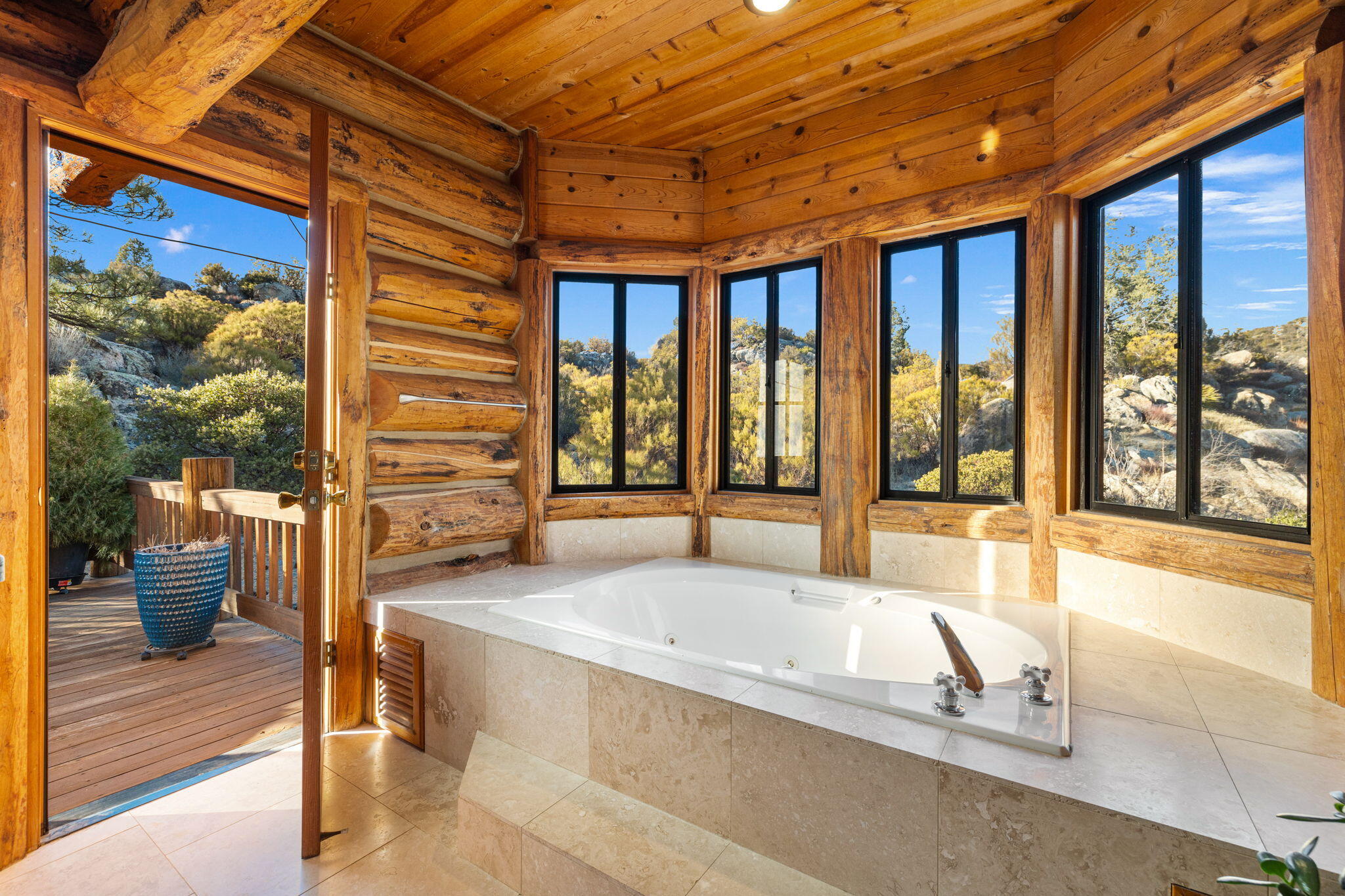 60766 Table Mountain Road Mountain Center, CA 92561 - Photo 20 of 46 a spacious bathroom with a tub and large windows