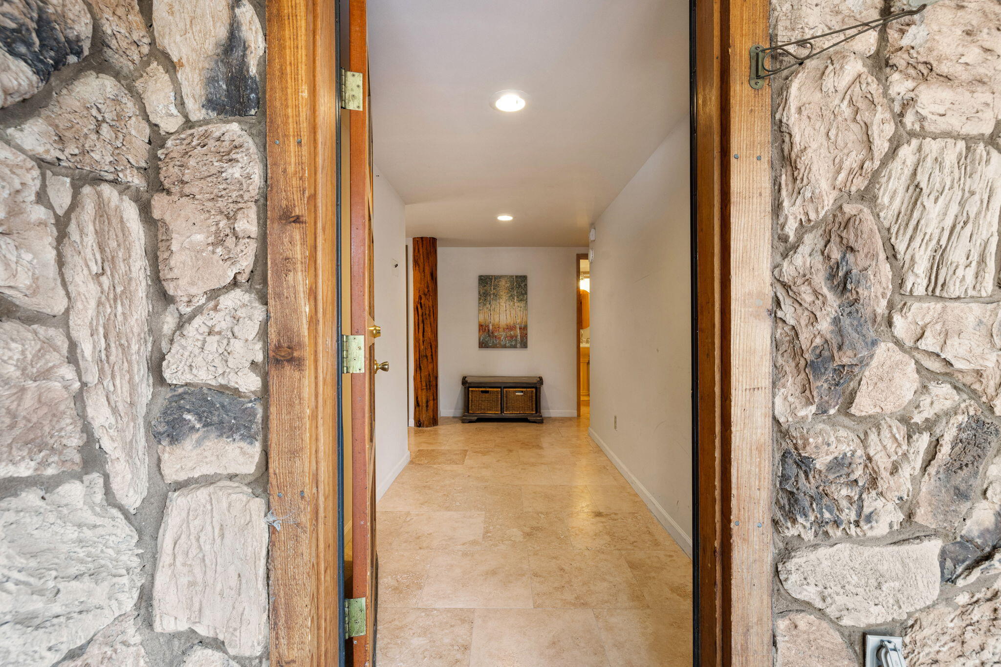 60766 Table Mountain Road Mountain Center, CA 92561 - Photo 35 of 46 a view of a hallway with wooden floor and a living room