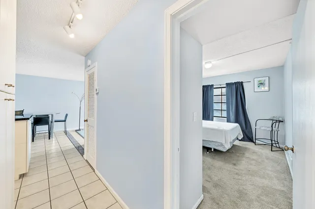 a bedroom with two beds and a dresser