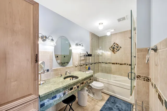 a bathroom with a sink and mirror