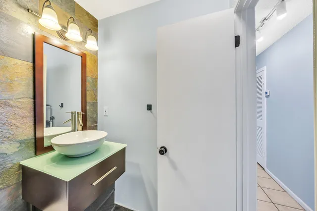 a view of a room with wooden floor and dining room
