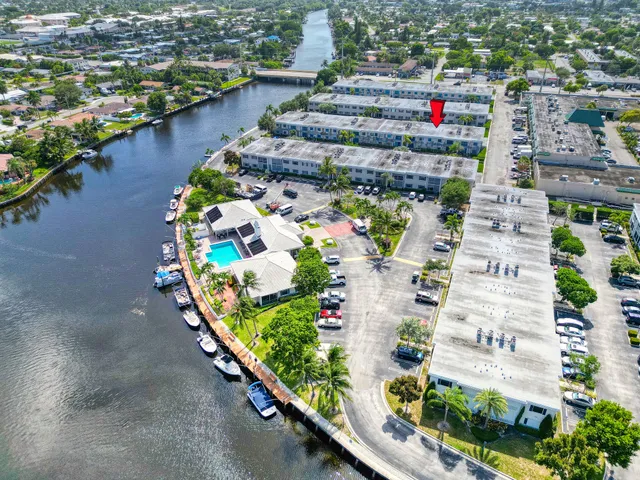 an aerial view of swimming pool with outdoor seating