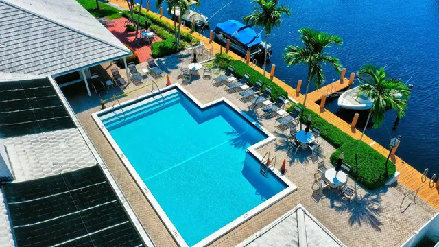 a view of a lake with boats and trees in the background
