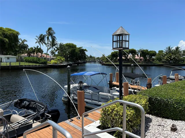 a room with pool table and windows