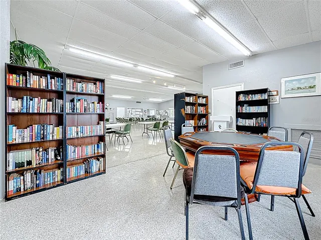 a view of a workspace with furniture and bathroom