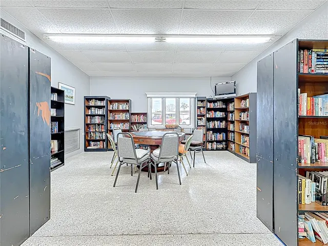 a view of a livingroom with furniture and workspace