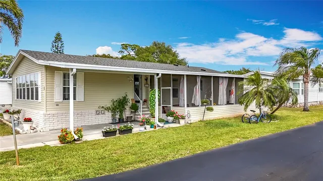 a front view of house with yard and seating space
