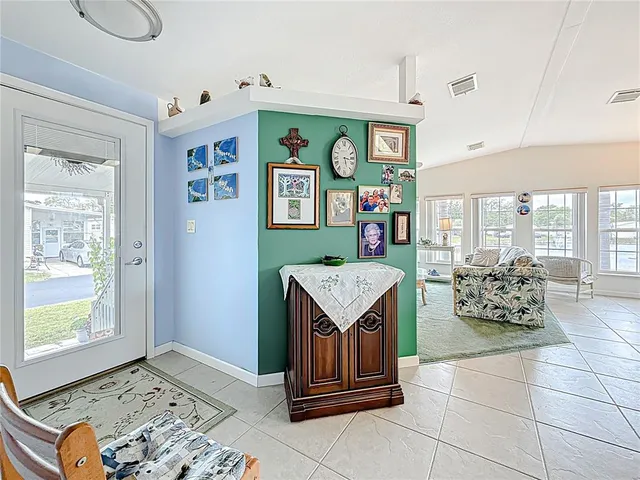 a living room with couch and window