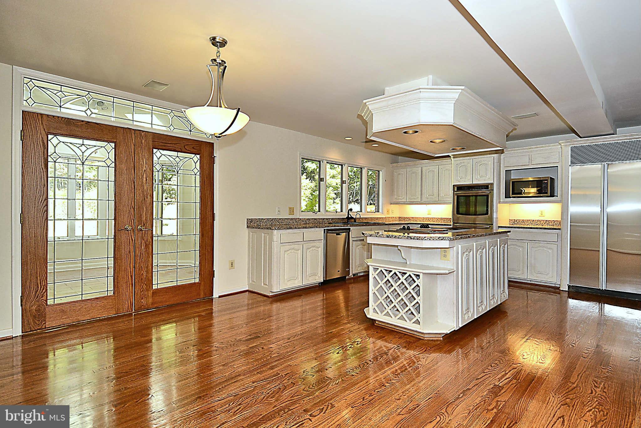 720 Clear Spring Road Great Falls, VA 22066 - Photo 2 of 30 Leaded glass doors lead to sunroom
