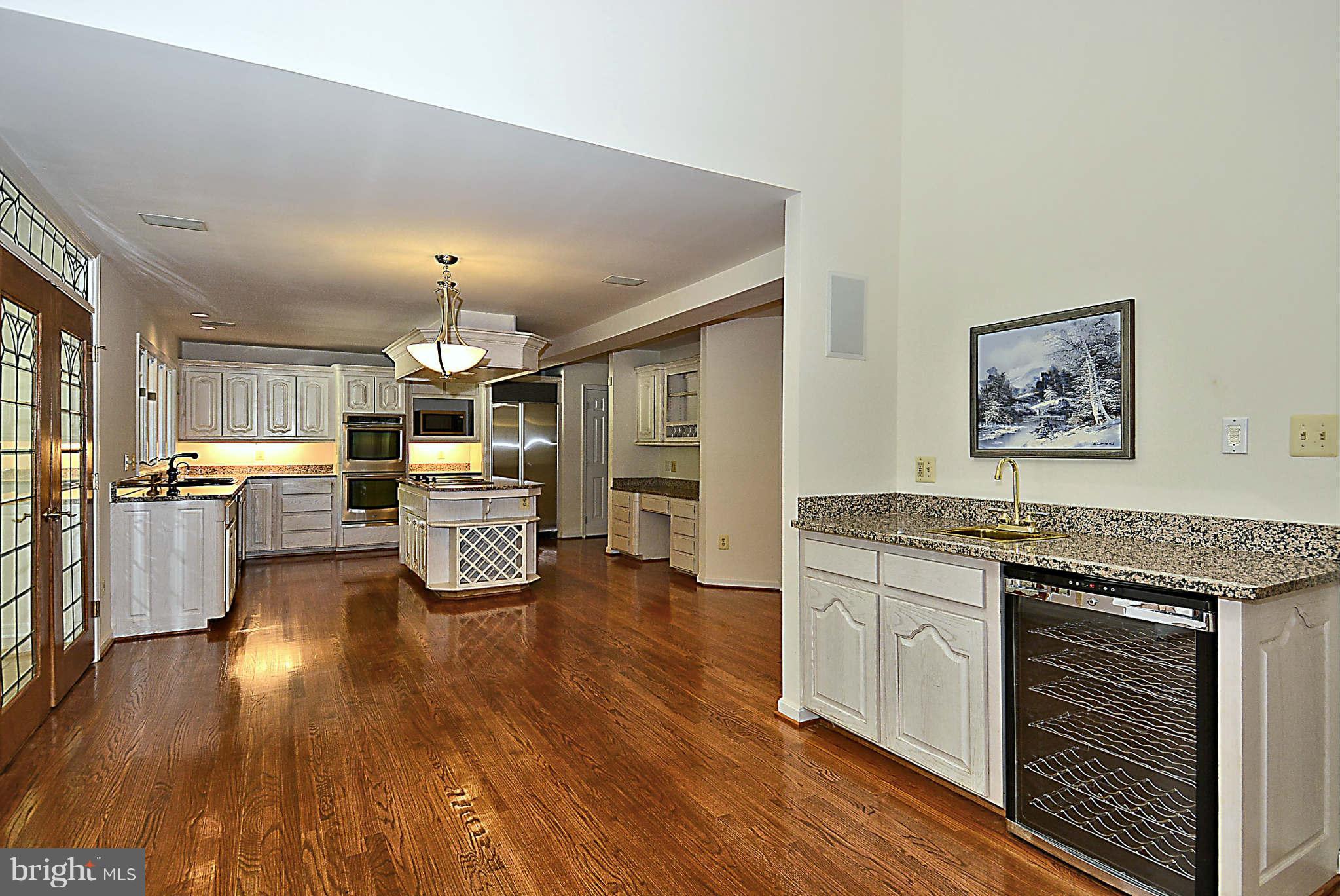 720 Clear Spring Road Great Falls, VA 22066 - Photo 5 of 30 Kitchen opens to the 2-story family room