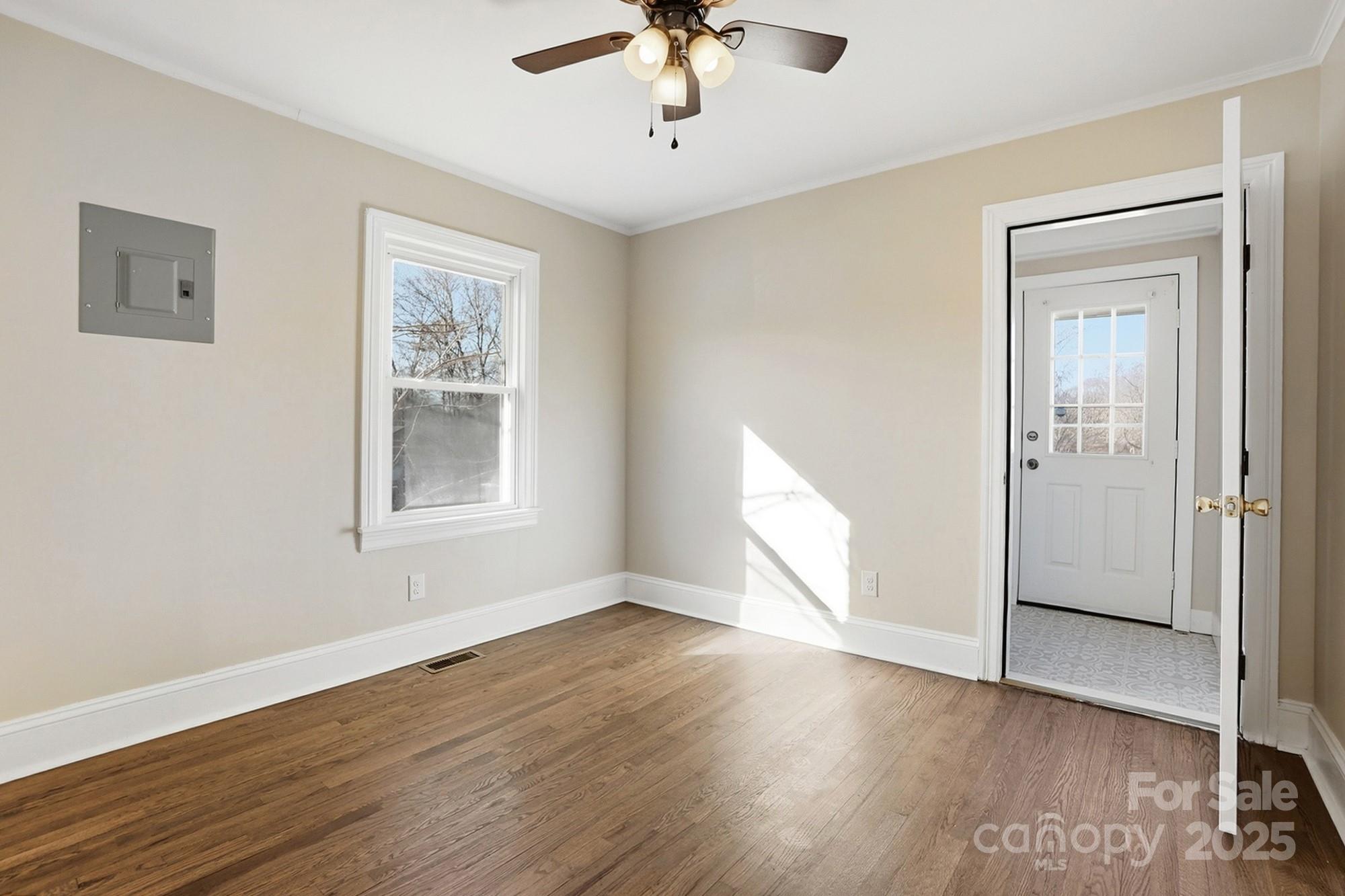 412 Ridge Street Stanley, NC 28164 - Photo 21 of 30 a view of empty room with wooden floor and fan