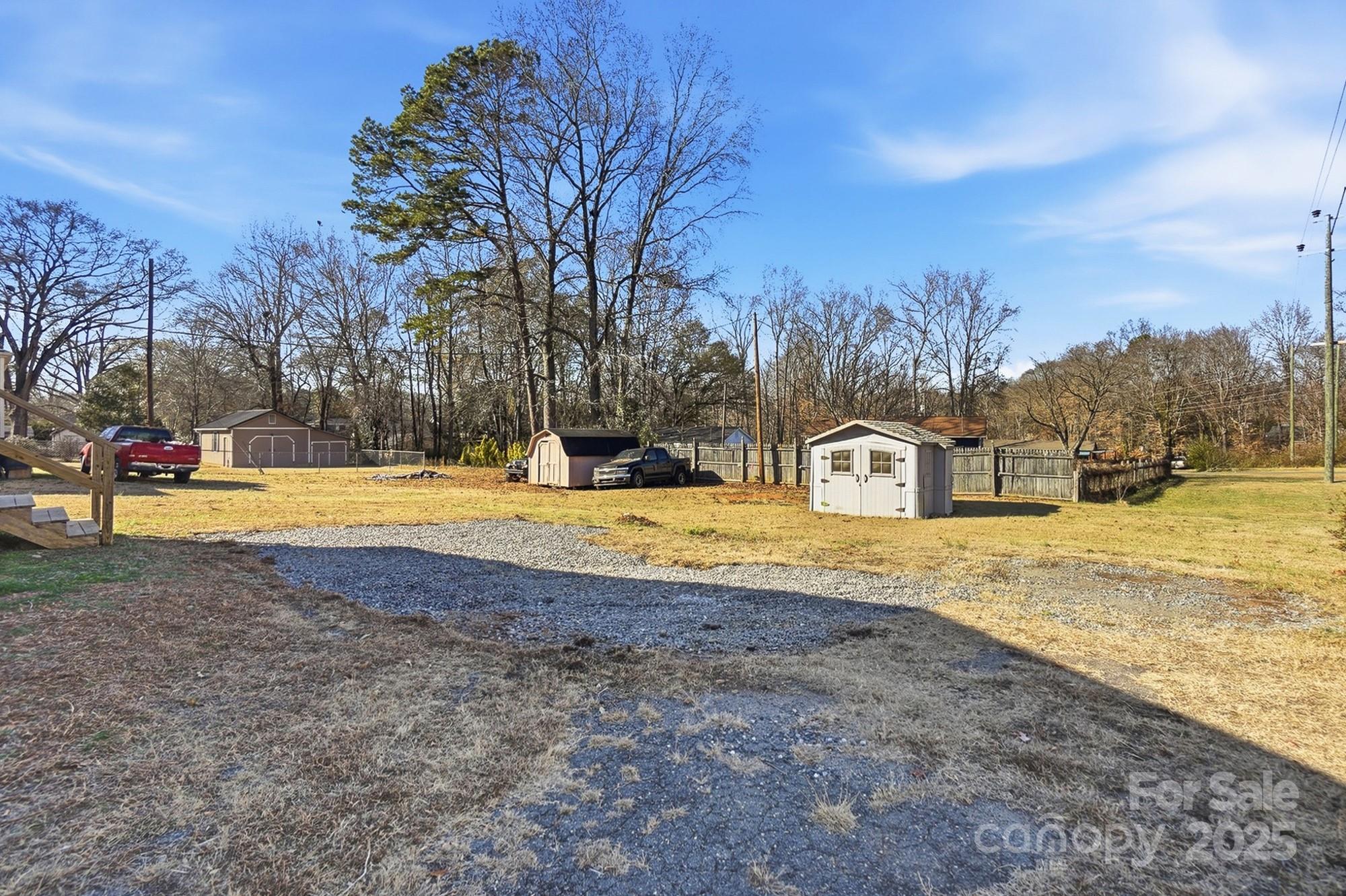 412 Ridge Street Stanley, NC 28164 - Photo 28 of 30 a view of swimming pool with a yard and trees